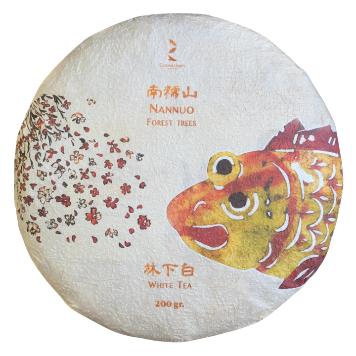White tea cake with fish illustration and text