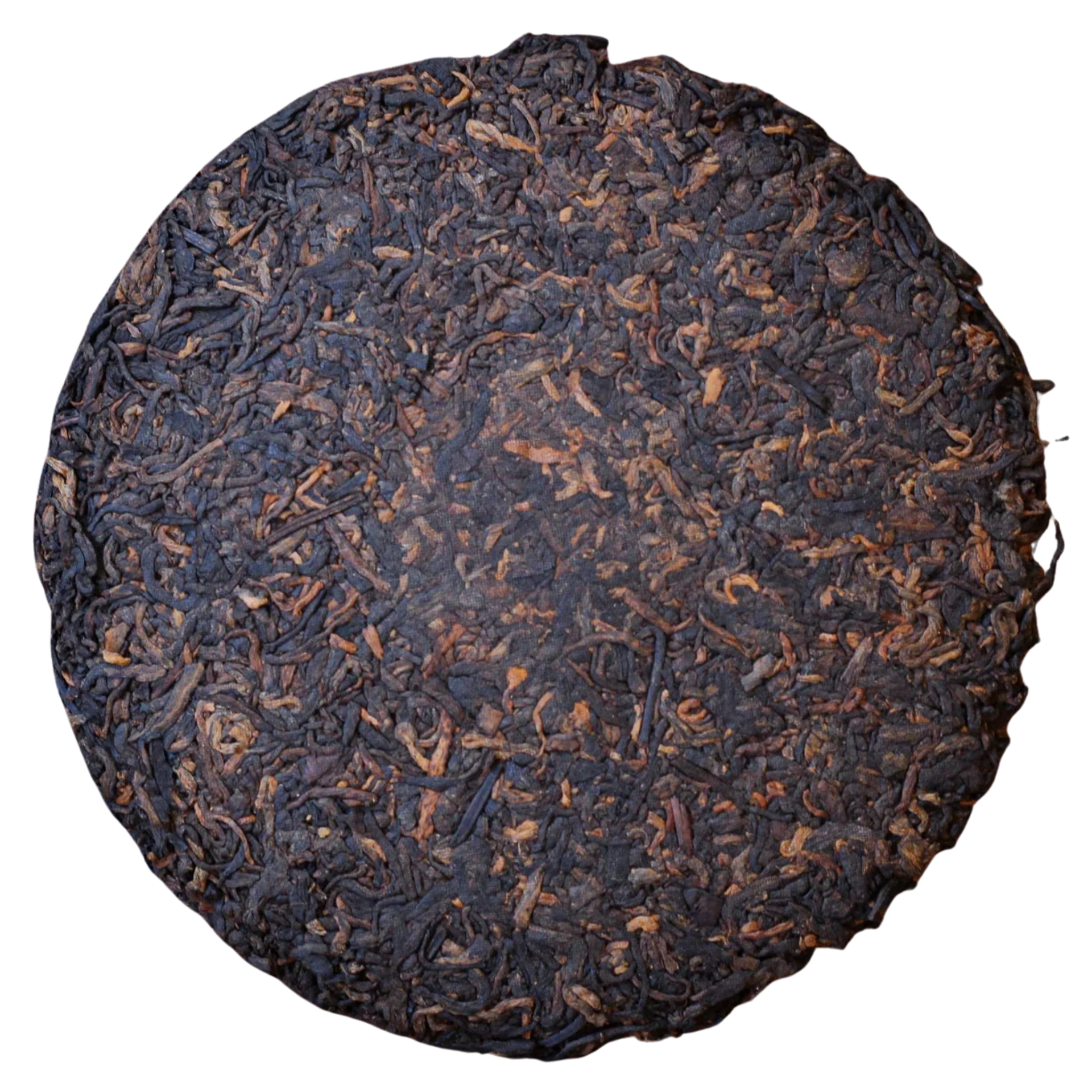 Round compressed Shu Pu'er tea cake with dark brown leaves
