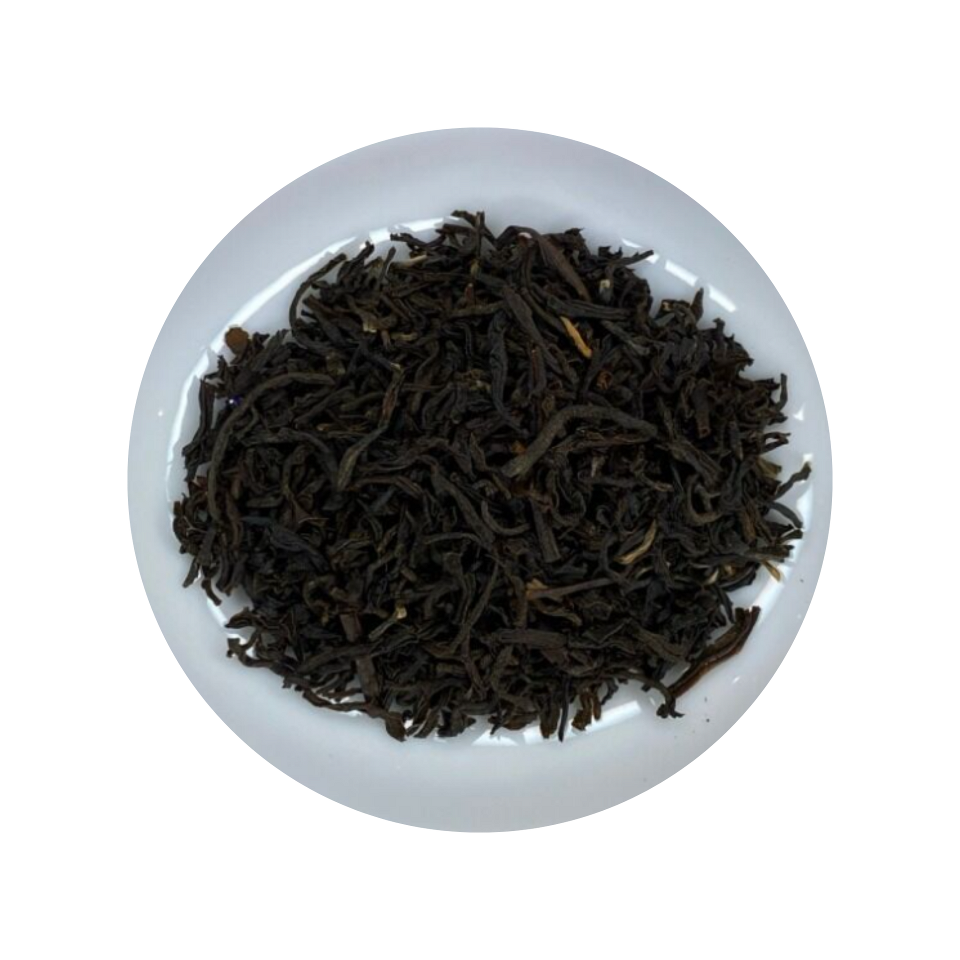 Dark Assam Tea leaves in a white bowl