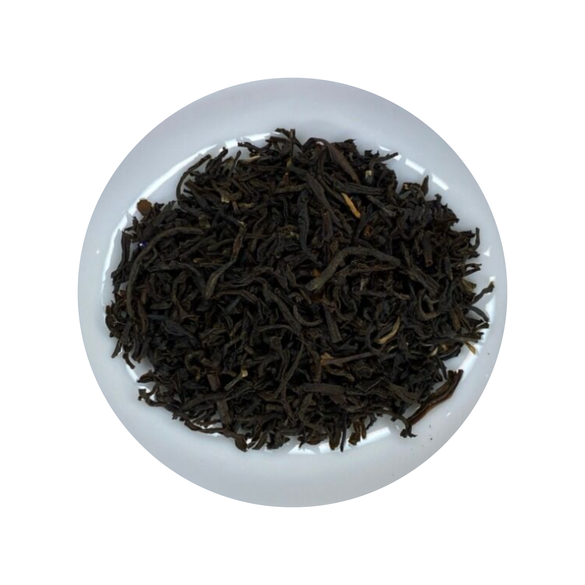 Dark Assam Tea leaves in a white bowl