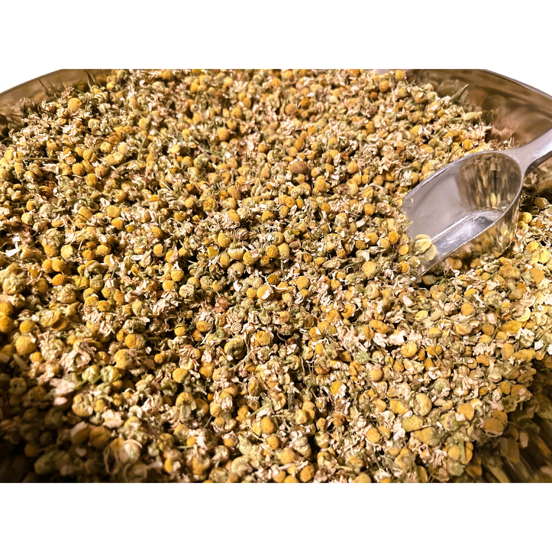 Big bowl of dried chamomile flowers and a metal spoon