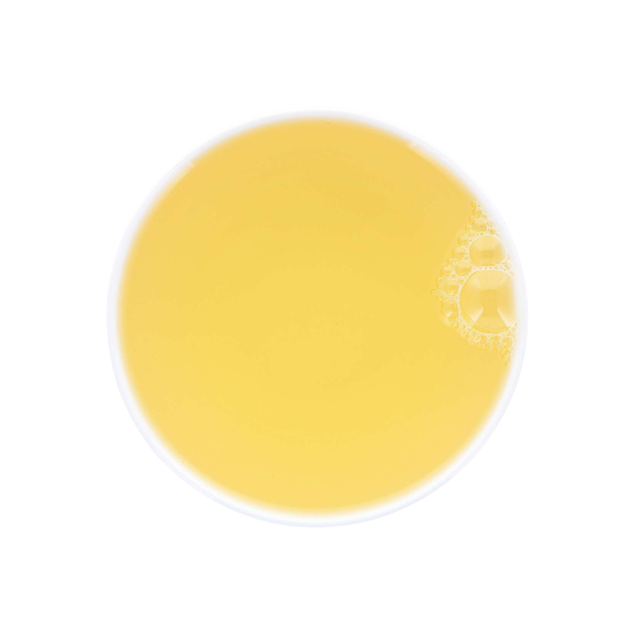 Yellow Mao Feng Green tea soup in a white cup