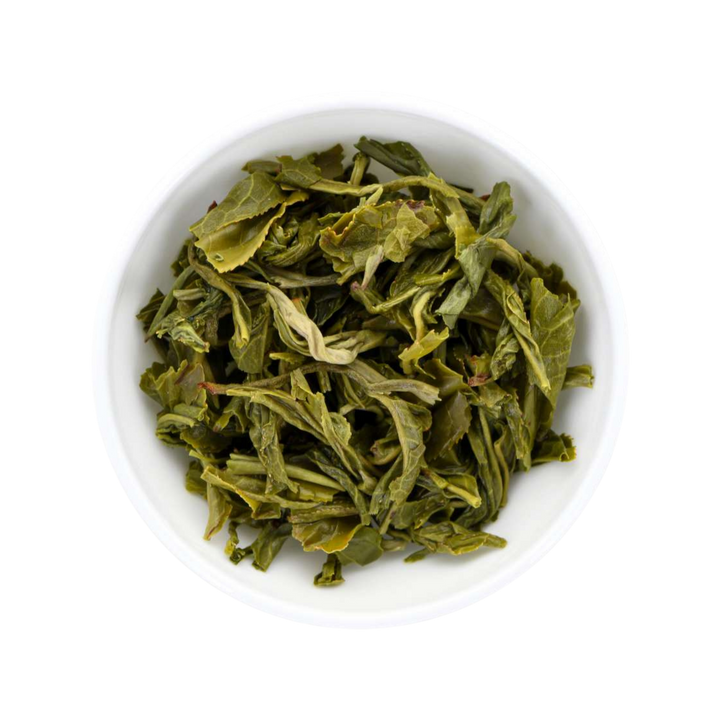 Chinese Mao Feng wet tea leaves in a white bowl