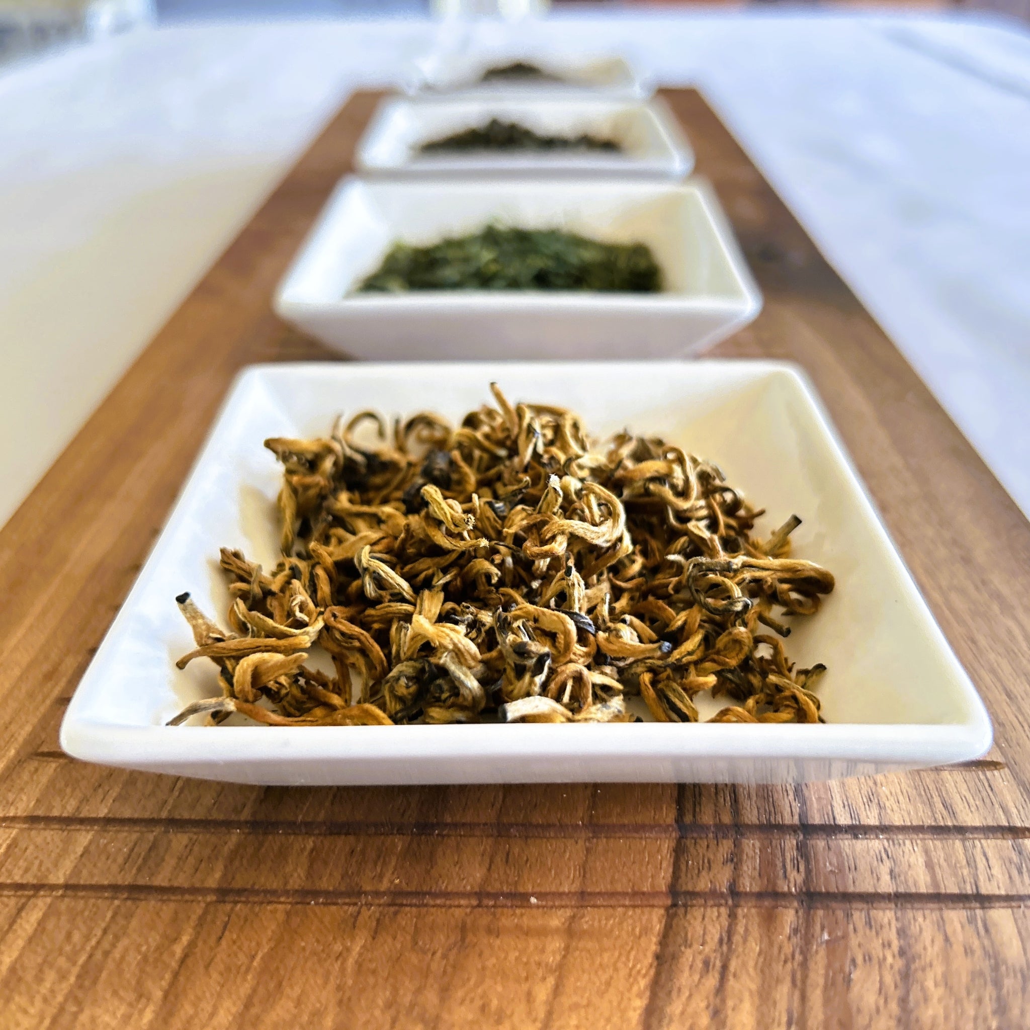 China Jin Mao Hou tea on display different types of teas the background