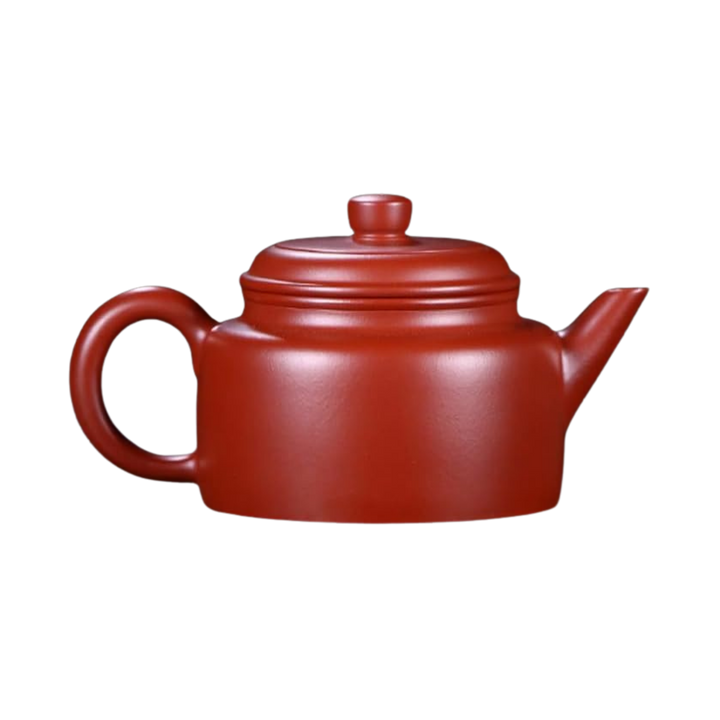 Red ceramic Yixing teapot seen from side