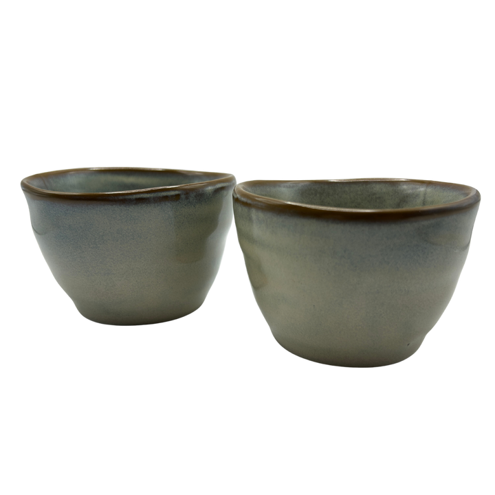 Two ceramic tea cups with a grayish-cloudy blue glaze
