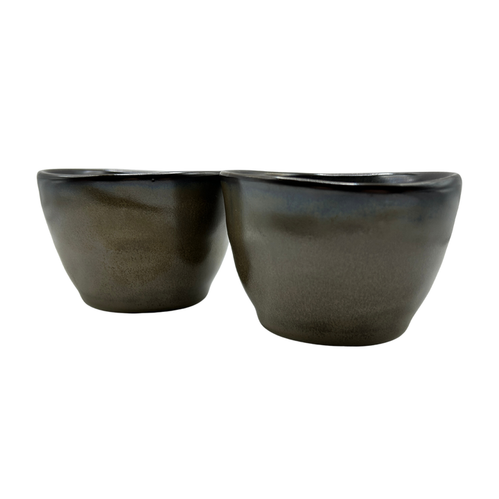 Two cloudy brown ceramic tea cups