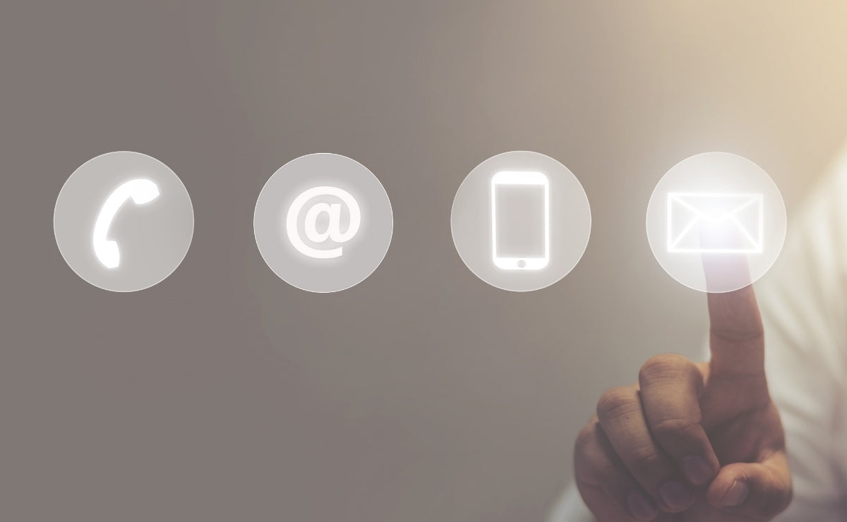 Hand interacting with digital contact icons on a blurred background