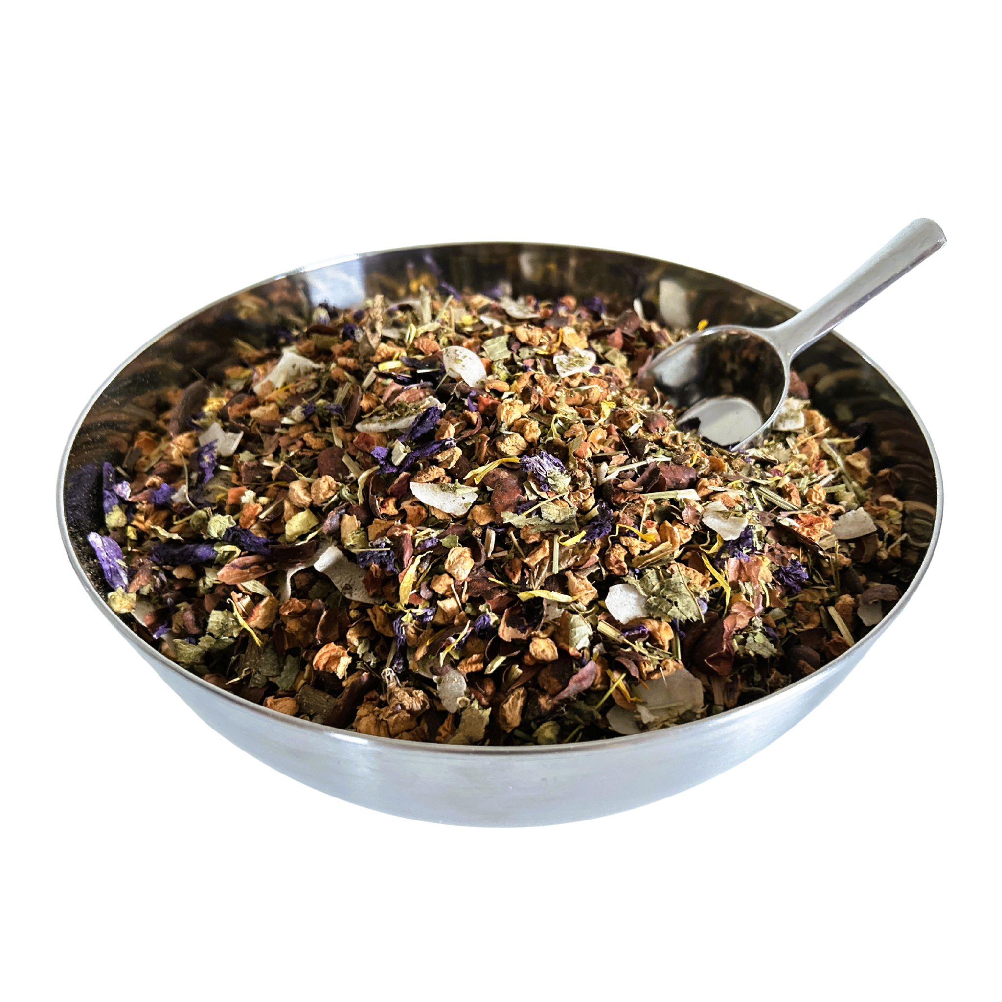 Big metal bowl full of dried herbals and flowers with a metal spoon