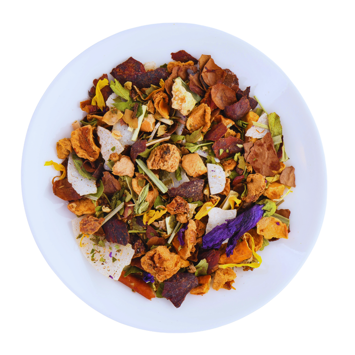 Colorful mix of herbs in a white bowl