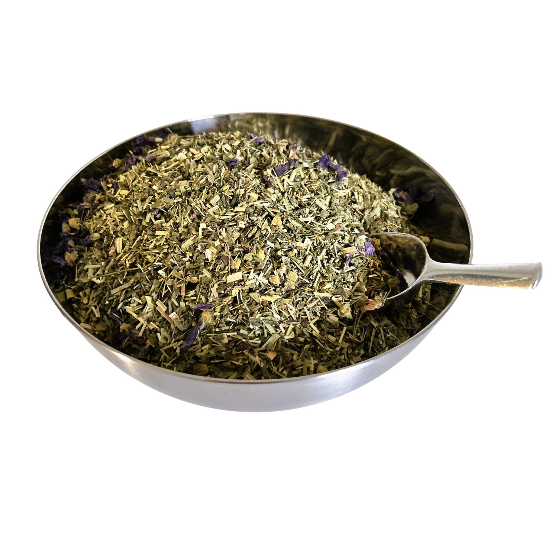 Big metal bowl full of dried herbals and flowers with a metal spoon