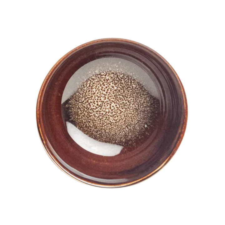 Japanese brown ceramic Matcha bowl with a textured pattern at the bottom