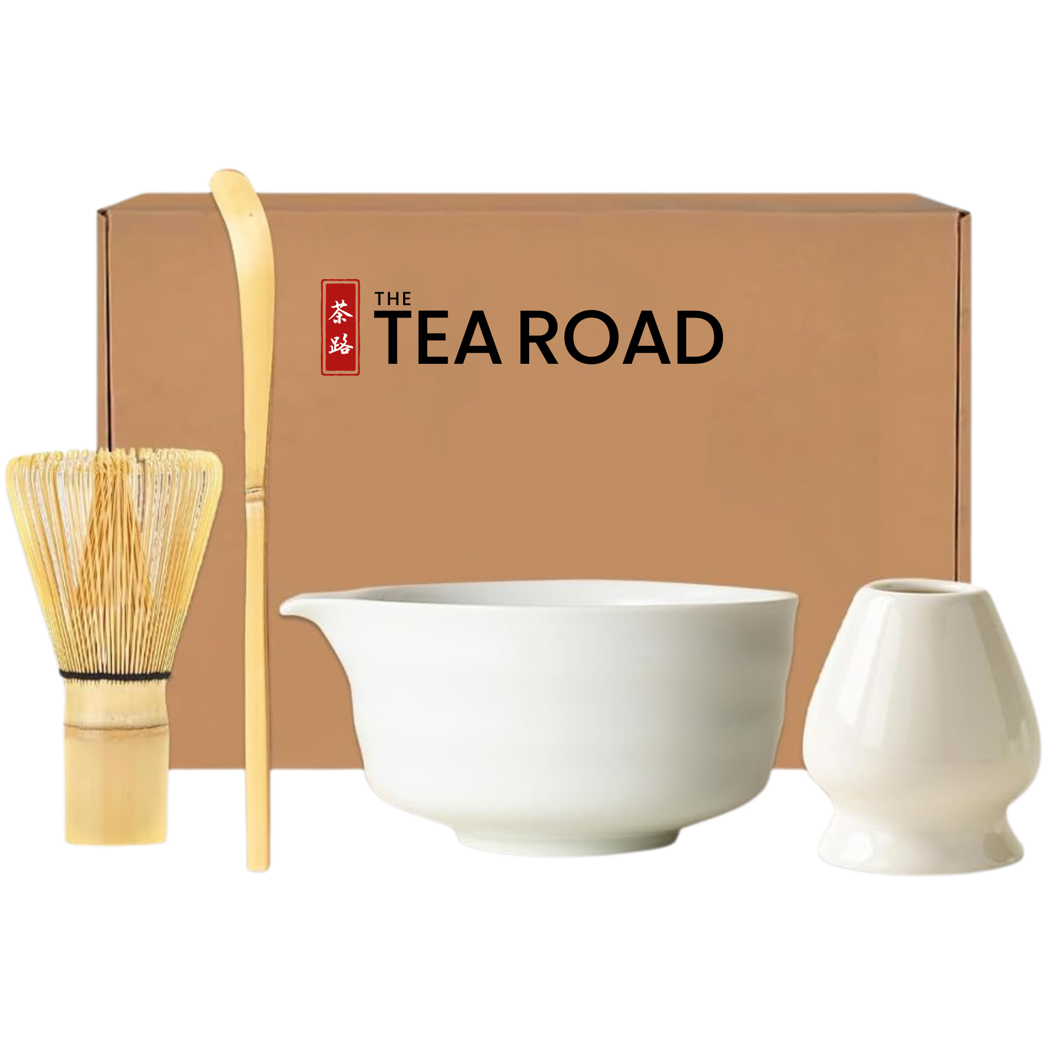 Japanese Matcha set with a white Matcha bowl with a pouring "nose" plus a whisk, a spoon and a whisk holder, all placed in front of 'The Tea Road' branded box.