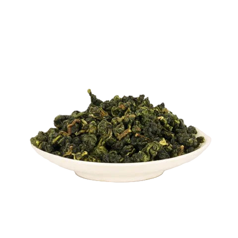 Green rolled Oolong tea leaves in a white bowl