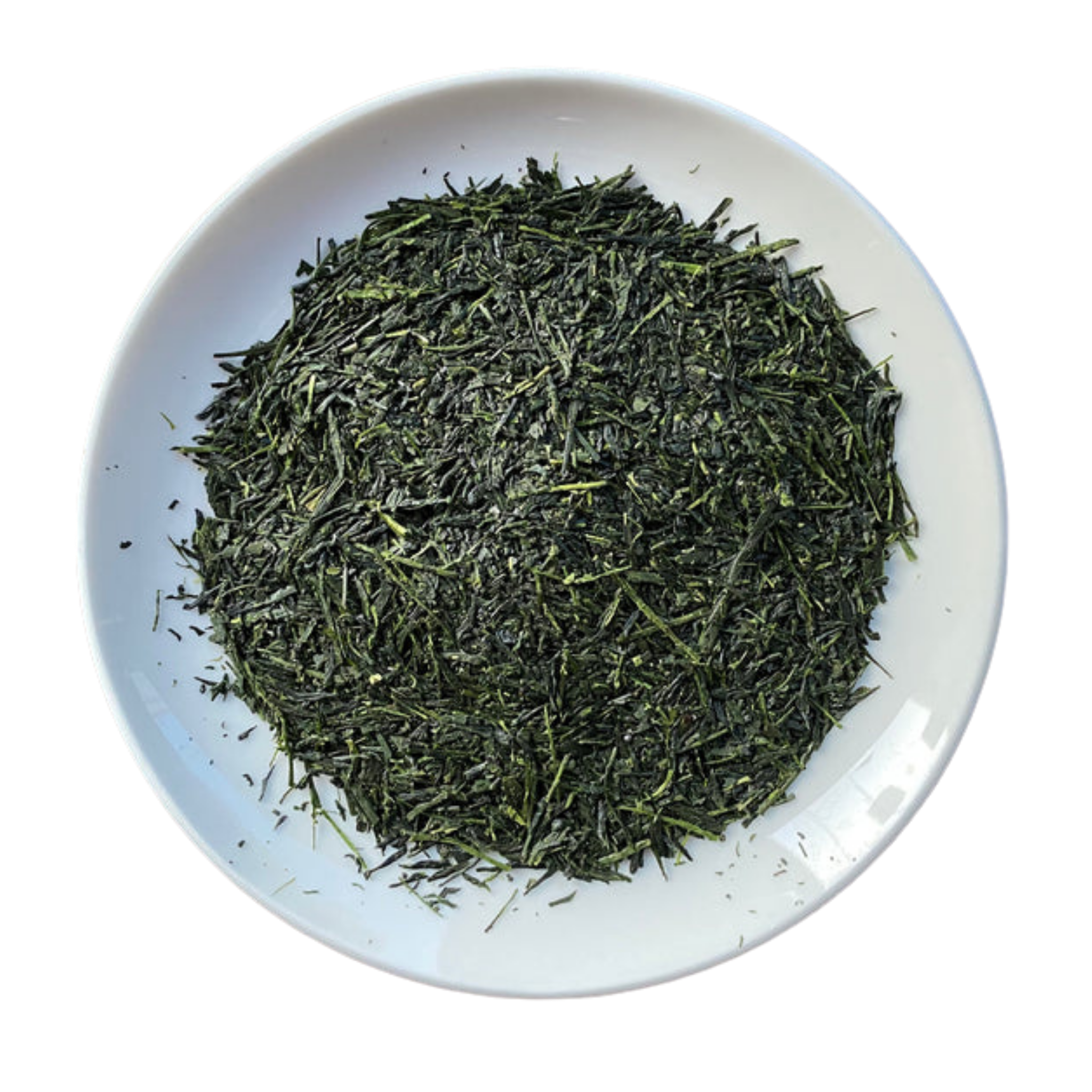 A top-down view of loose-leaf green tea piled in the center of a white ceramic plate