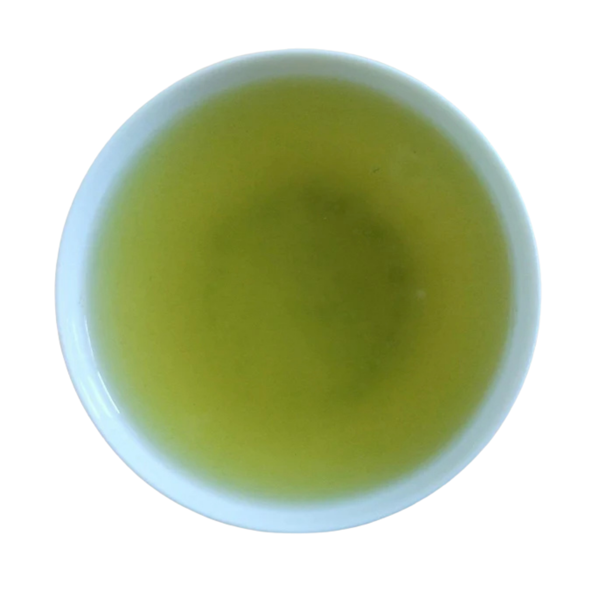 A top-down view of a white cup filled with light yellow-green tea