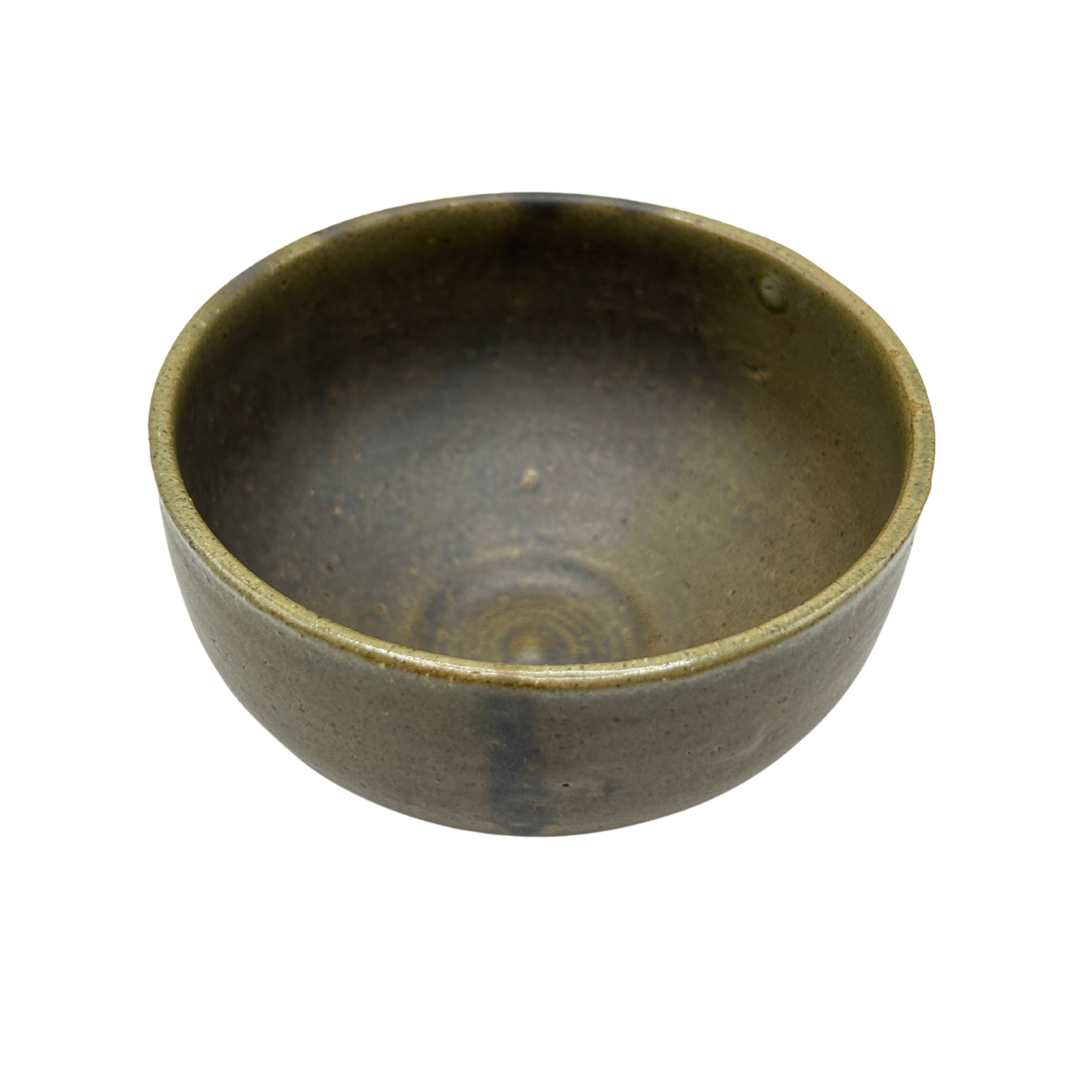 Dusty green Matcha bowl with dark patterns seen from above