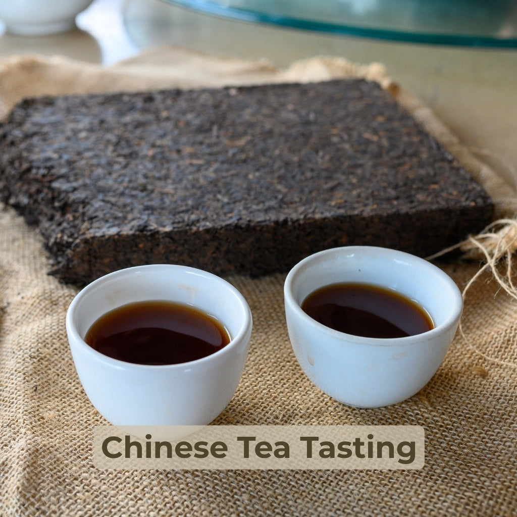 A block of dark pu'er tea and 2 cups