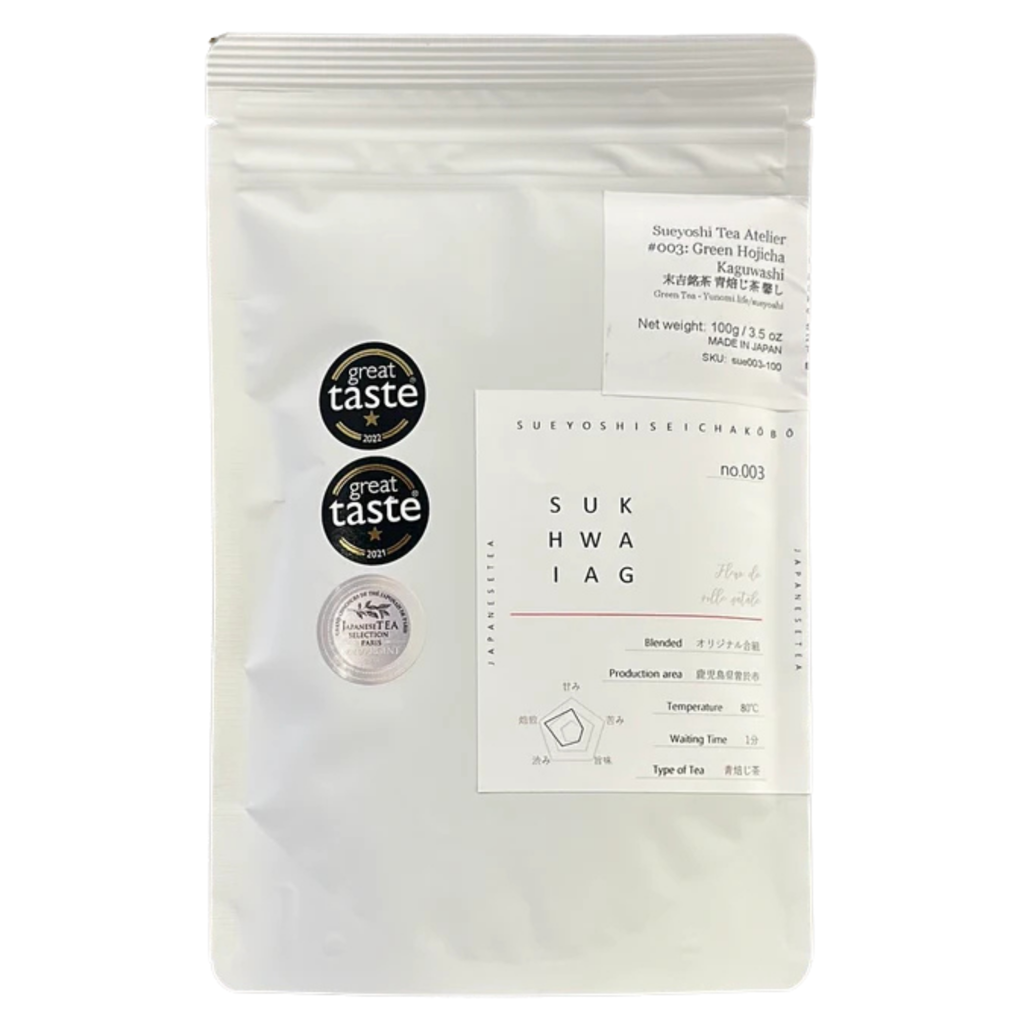 A white stand-up pouch of Green Hojicha tea with two black circular 'great taste' seals and a small silver foil seal.