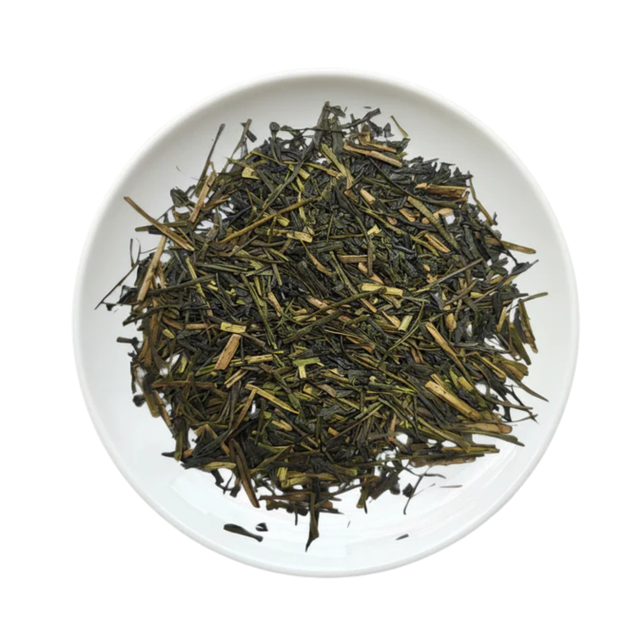 A top-down view of loose-leaf tea leaves, showing dark green and light brown needles, presented in a white ceramic plate
