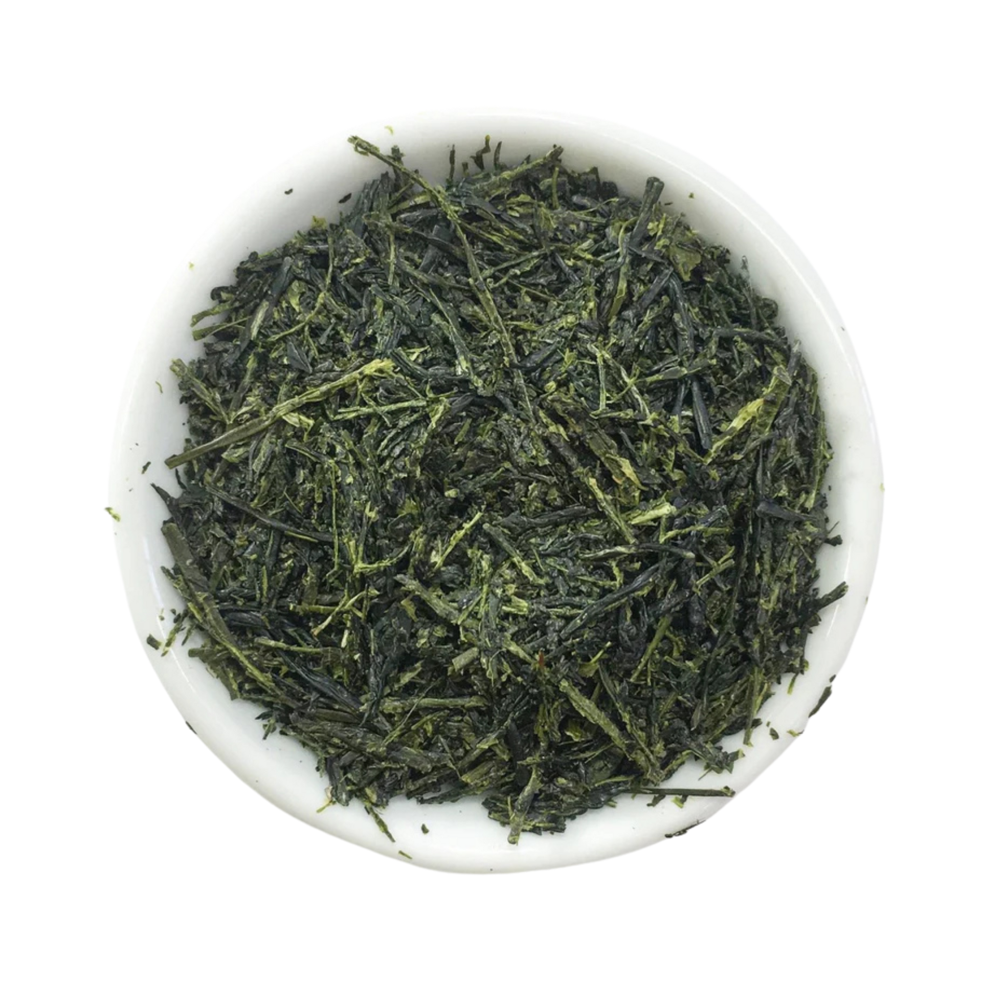Dried loose-leaf green tea leaves piled in a small white ceramic bowl  photographed from above