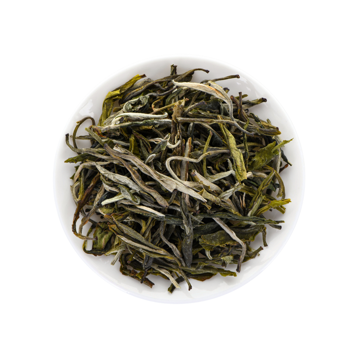 A top-down view of loose-leaf tea leaves, showing green and white buds with dark stems, presented in a small white bowl