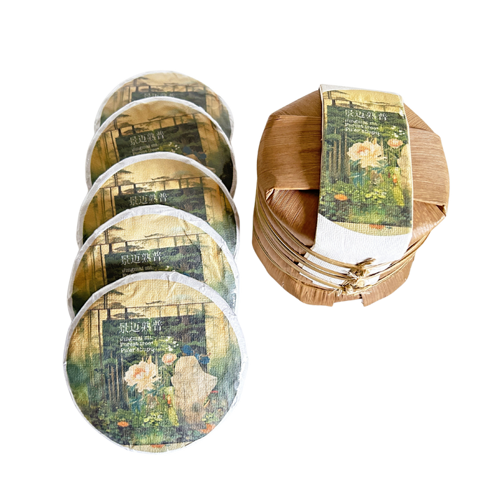 Tea cakes and a round tea tong with artistic designs